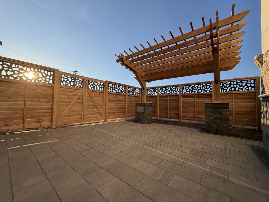 custom wood pergola with decorative privacy fence installed in twin cities mn